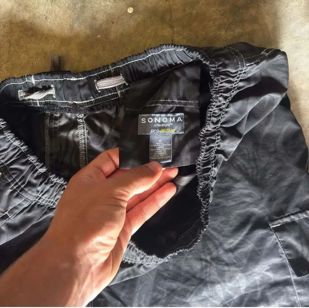 Vintage 90s tribal flames black board shorts surf skate